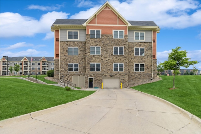 1250 SW Magazine Rd Unit 215, Ankeny, IA 50023 - view of building exterior with an attached garage and concrete driveway