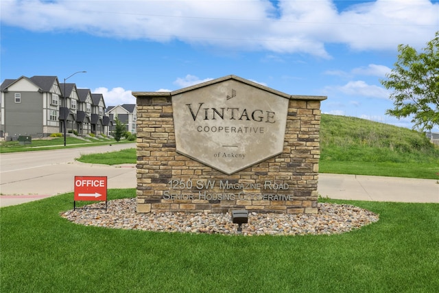 1250 SW Magazine Rd Unit 215, Ankeny, IA 50023 - community / neighborhood sign featuring a lawn and a residential view