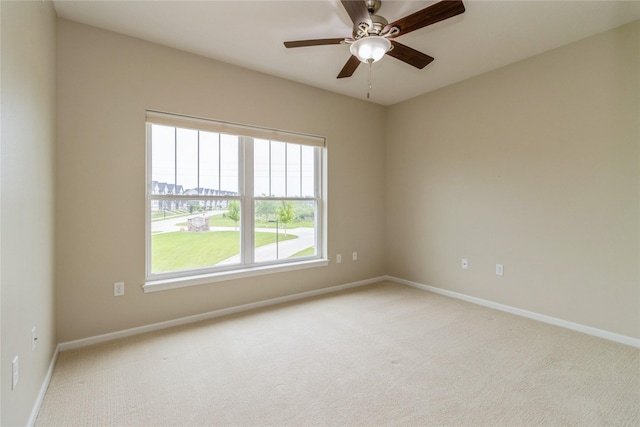 1250 SW Magazine Rd Unit 215, Ankeny, IA 50023 - empty room with light carpet, plenty of natural light, and ceiling fan