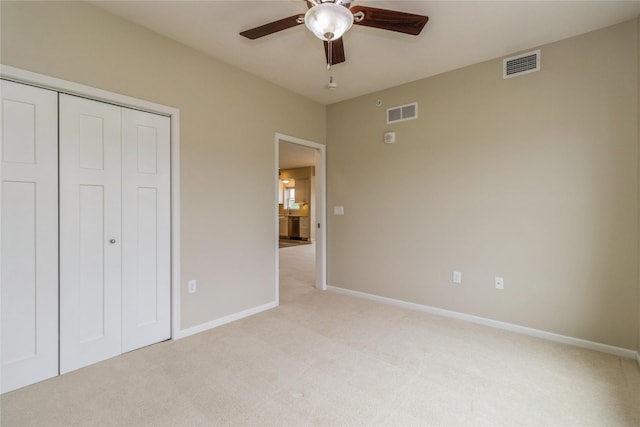 1250 SW Magazine Rd Unit 215, Ankeny, IA 50023 - unfurnished bedroom with light colored carpet, a closet, and ceiling fan