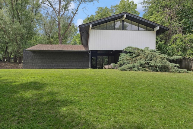 1808 80th St, Windsor Heights, IA 50324 - rear view of property featuring a lawn
