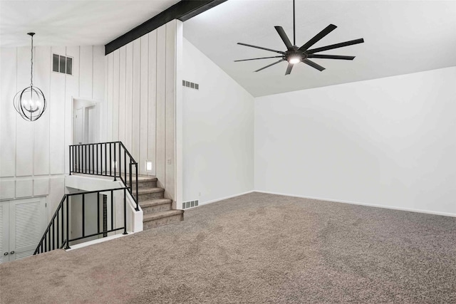 1808 80th St, Windsor Heights, IA 50324 - unfurnished living room with ceiling fan, carpet, a chandelier, high vaulted ceiling, and stairs