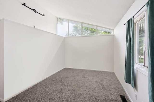 1808 80th St, Windsor Heights, IA 50324 - empty room with carpet flooring and lofted ceiling