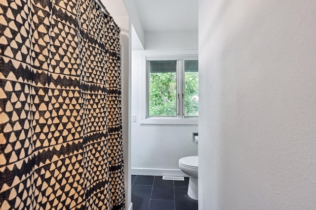 1808 80th St, Windsor Heights, IA 50324 - bathroom featuring tile patterned floors and toilet