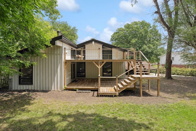 1808 80th St, Windsor Heights, IA 50324 - rear view of property with a wooden deck, stairway, a lawn, and board and batten siding
