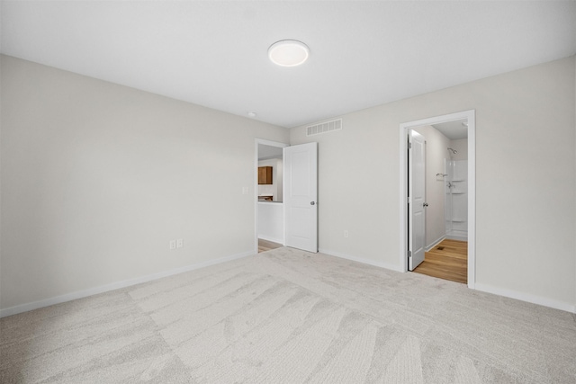 4400 Honey Bee Rdg, Des Moines, IA 50317 - unfurnished bedroom featuring carpet flooring and ensuite bath