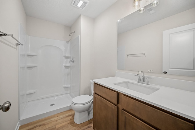 4400 Honey Bee Rdg, Des Moines, IA 50317 - full bath with wood finished floors, a shower, and vanity