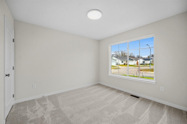 4400 Honey Bee Rdg, Des Moines, IA 50317 - empty room featuring carpet floors and baseboards
