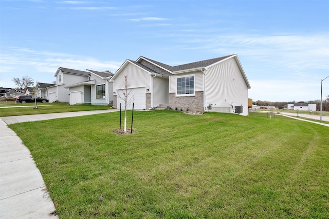 4400 Honey Bee Rdg, Des Moines, IA 50317 - view of front of house with an attached garage, driveway, and a front yard