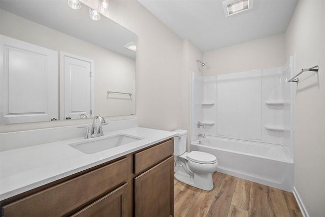 4400 Honey Bee Rdg, Des Moines, IA 50317 - bathroom with vanity, wood finished floors, and shower / bath combination