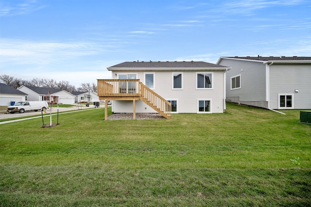 4400 Honey Bee Rdg, Des Moines, IA 50317 - back of house featuring a deck, a yard, and stairway