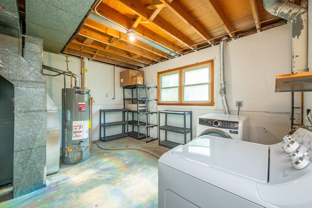 108 56th St, Des Moines, IA 50312 - below grade area featuring gas water heater and washing machine and clothes dryer