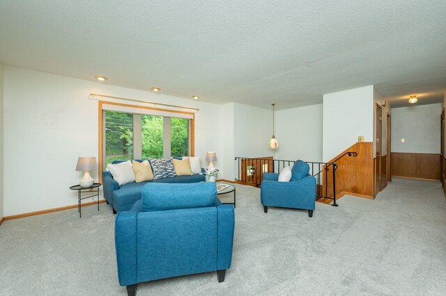 108 56th St, Des Moines, IA 50312 - living area featuring carpet and a textured ceiling
