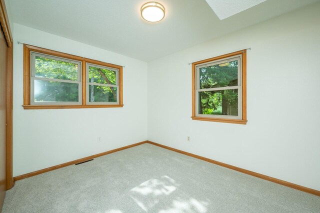 108 56th St, Des Moines, IA 50312 - unfurnished room with healthy amount of natural light and carpet flooring