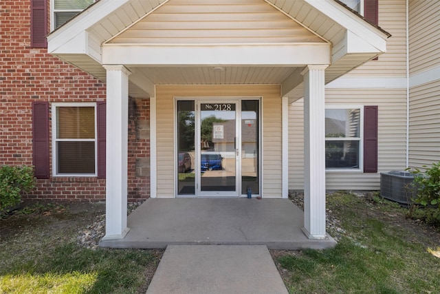2128 NW 156th St Unit 31, Clive, IA 50325 - property entrance with brick siding and a porch