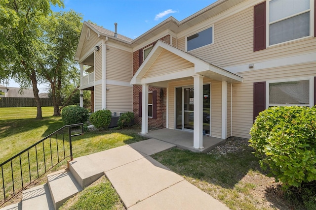 2128 NW 156th St Unit 31, Clive, IA 50325 - view of front of home with brick siding and a porch