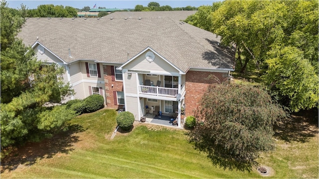 2128 NW 156th St Unit 31, Clive, IA 50325 - back of house featuring a patio area, a lawn, brick siding, and a balcony