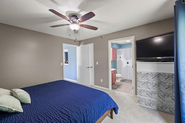 2128 NW 156th St Unit 31, Clive, IA 50325 - carpeted bedroom featuring connected bathroom and ceiling fan
