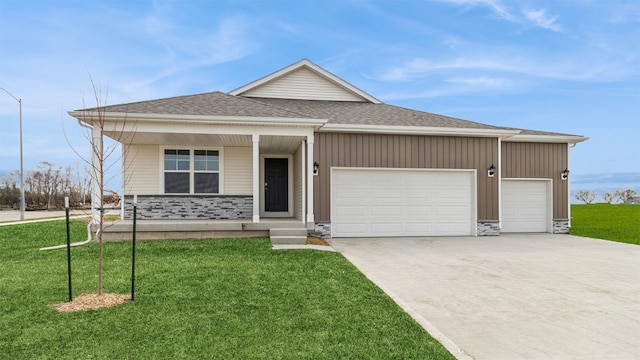 1030 34th St SE, Altoona, IA 50009 - ranch-style house with a garage, driveway, a front lawn, and stone siding