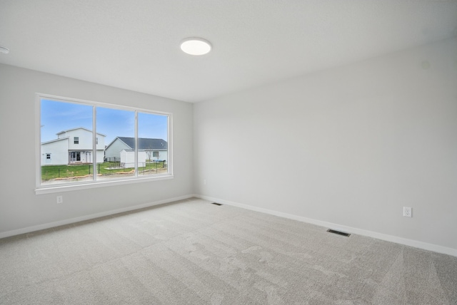 1819 Tuscany Dr SE, Altoona, IA 50009 - carpeted spare room with baseboards
