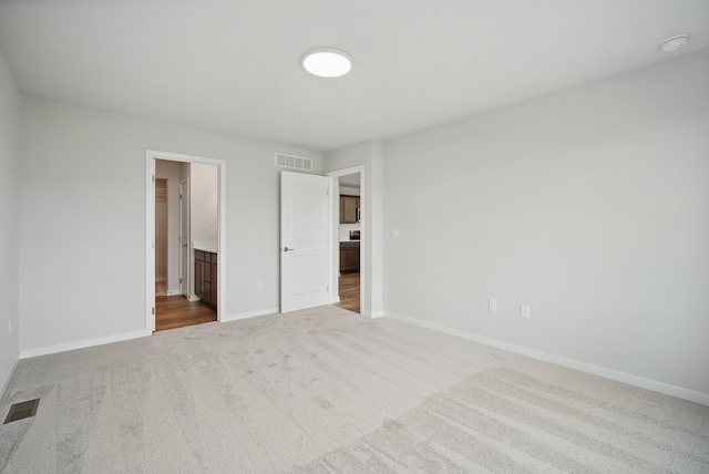 1819 Tuscany Dr SE, Altoona, IA 50009 - unfurnished bedroom featuring carpet flooring and connected bathroom