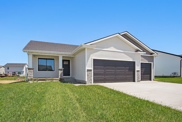 1819 Tuscany Dr SE, Altoona, IA 50009 - view of front of house with a garage, driveway, a front lawn, and roof with shingles
