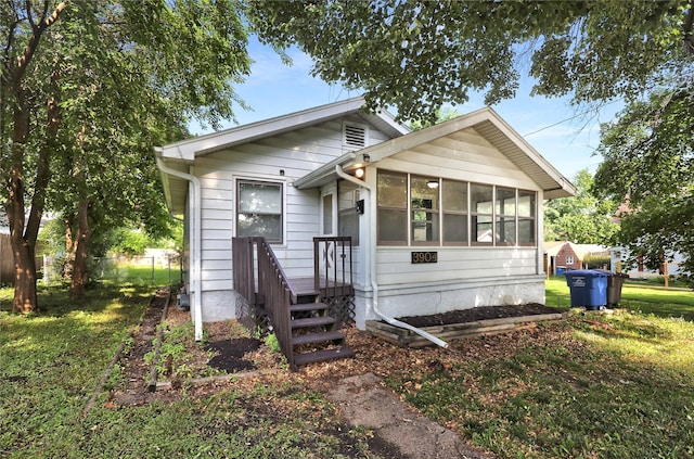 3904 3rd St, Des Moines, IA 50313 - view of front of property with a sunroom