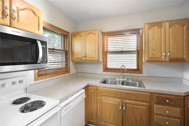 3904 3rd St, Des Moines, IA 50313 - kitchen with white appliances, light brown cabinetry, and light countertops