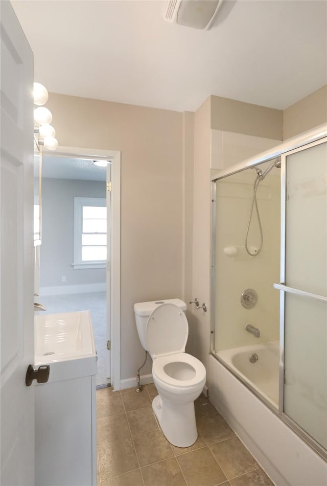 3904 3rd St, Des Moines, IA 50313 - bathroom featuring vanity, shower / bath combination with glass door, and tile patterned flooring