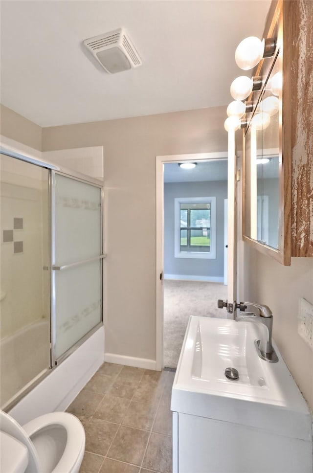 3904 3rd St, Des Moines, IA 50313 - bathroom with vanity, enclosed tub / shower combo, and tile patterned floors
