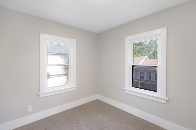 3904 3rd St, Des Moines, IA 50313 - spare room with carpet and baseboards
