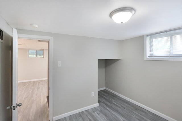 3904 3rd St, Des Moines, IA 50313 - unfurnished room with wood finished floors and a smoke detector