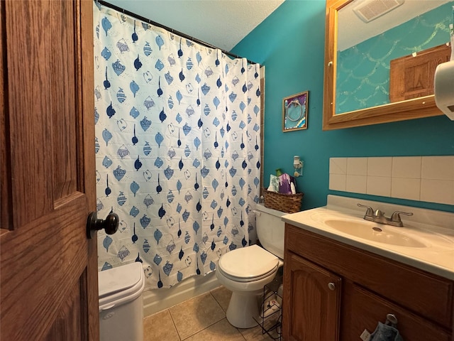 1105 Bundy St, Des Moines, IA 50315 - bathroom with tile patterned flooring, vanity, and shower / tub combo with curtain