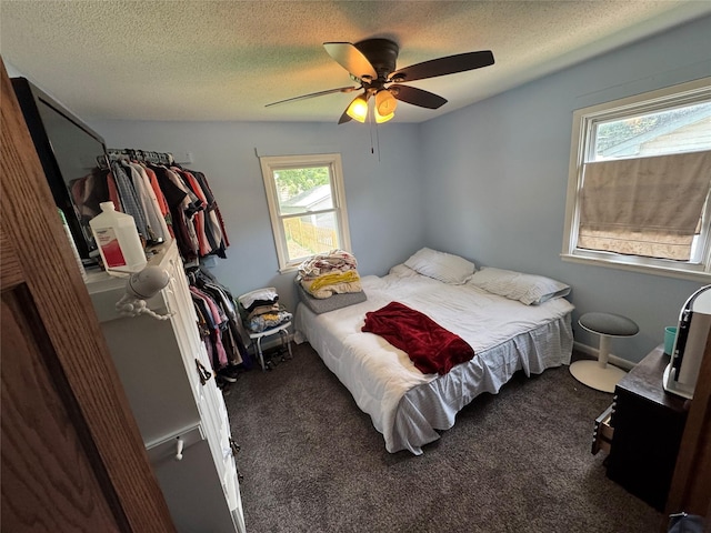 1105 Bundy St, Des Moines, IA 50315 - bedroom featuring carpet, ceiling fan, and a textured ceiling