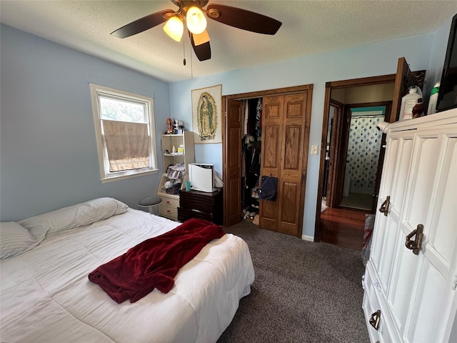 1105 Bundy St, Des Moines, IA 50315 - bedroom featuring carpet floors, a closet, a textured ceiling, and a ceiling fan