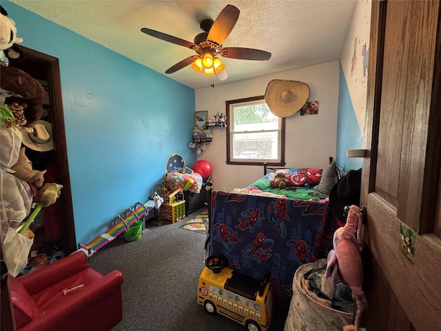 1105 Bundy St, Des Moines, IA 50315 - bedroom featuring a textured ceiling, carpet, and ceiling fan