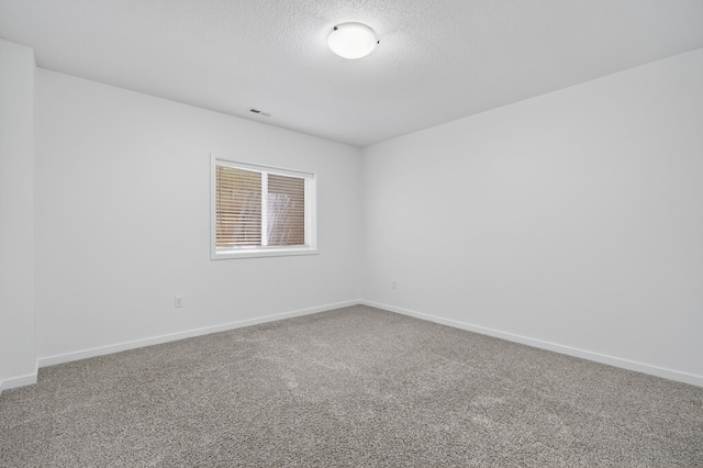9322 Bellflower Ln, Norwalk, IA 50211 - unfurnished room featuring carpet and a textured ceiling