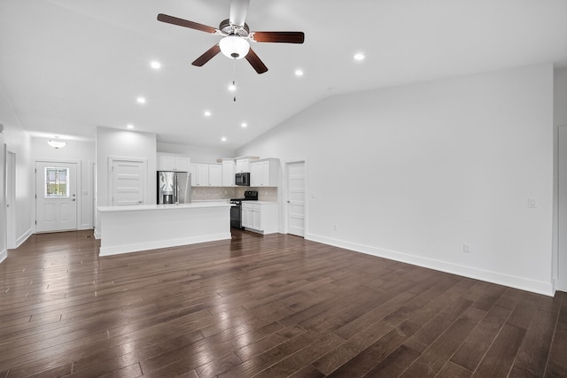 9322 Bellflower Ln, Norwalk, IA 50211 - unfurnished living room featuring a ceiling fan, dark wood-style floors, lofted ceiling, and recessed lighting