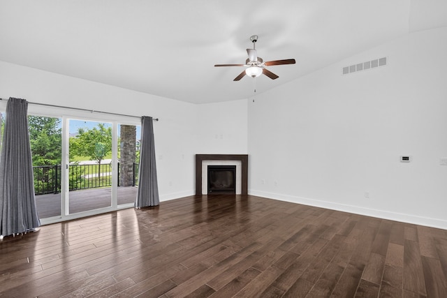 9322 Bellflower Ln, Norwalk, IA 50211 - unfurnished living room with a ceiling fan, a glass covered fireplace, and dark wood-style floors