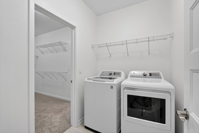 9322 Bellflower Ln, Norwalk, IA 50211 - laundry area featuring washer and clothes dryer and light carpet