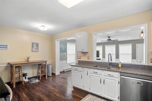 1034 66th St, Windsor Heights, IA 50324 - kitchen featuring stainless steel dishwasher, ceiling fan, white cabinetry, and dark countertops