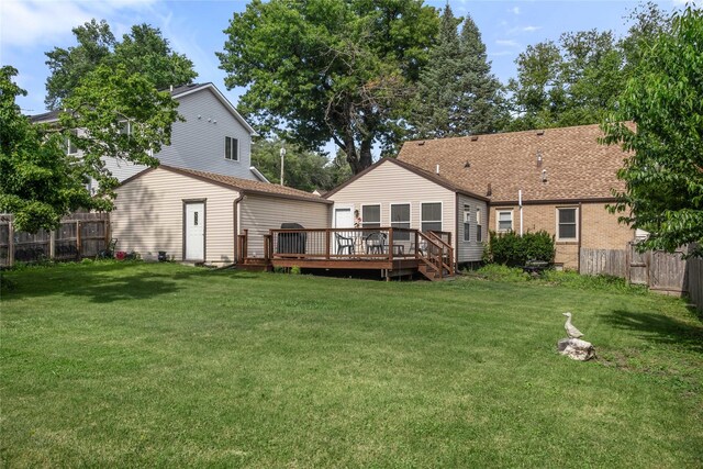 1034 66th St, Windsor Heights, IA 50324 - back of house featuring a deck and a fenced backyard
