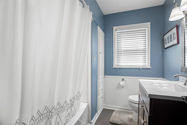 1034 66th St, Windsor Heights, IA 50324 - bathroom with vanity, wainscoting, and shower / bathtub combination with curtain