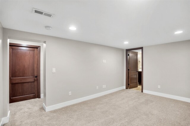 1034 66th St, Windsor Heights, IA 50324 - unfurnished room with a smoke detector, light carpet, and recessed lighting