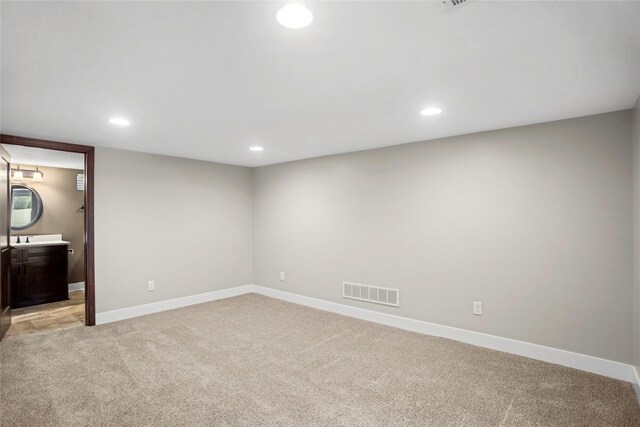 1034 66th St, Windsor Heights, IA 50324 - empty room with light carpet and recessed lighting