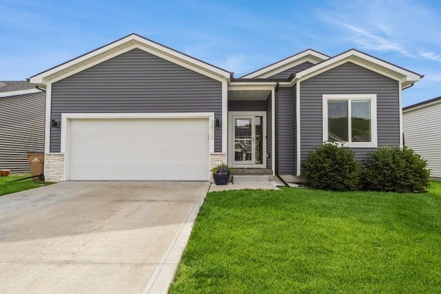 1636 S Redtail Ave, West Des Moines, IA 50265 - view of front of house featuring a front yard, concrete driveway, a garage, and stone siding
