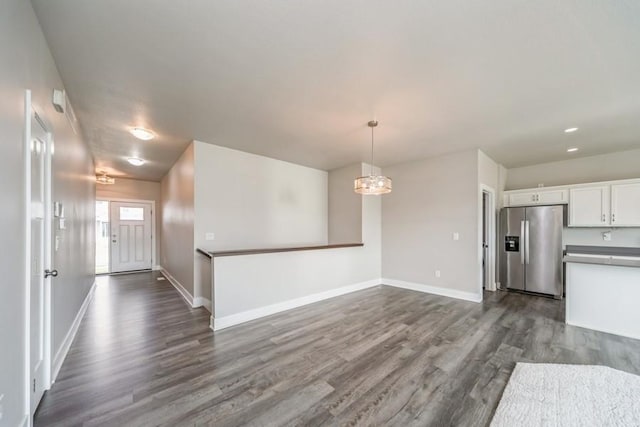 1636 S Redtail Ave, West Des Moines, IA 50265 - kitchen featuring stainless steel fridge, dark wood finished floors, white cabinets, a chandelier, and recessed lighting