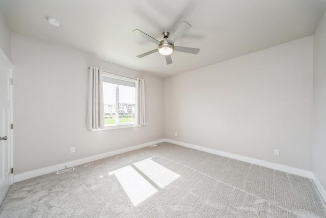 1636 S Redtail Ave, West Des Moines, IA 50265 - unfurnished room featuring carpet, a ceiling fan, and a smoke detector