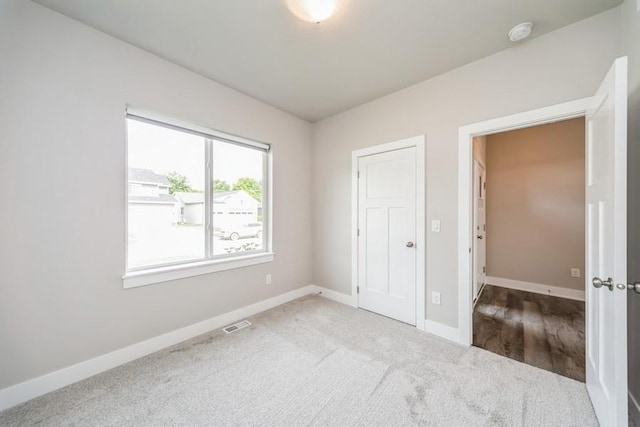 1636 S Redtail Ave, West Des Moines, IA 50265 - unfurnished bedroom featuring carpet and baseboards