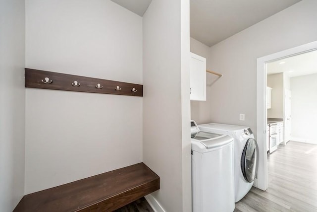 1636 S Redtail Ave, West Des Moines, IA 50265 - laundry room featuring washer and dryer and light wood finished floors